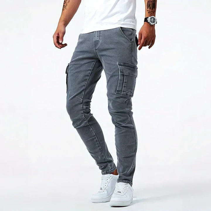 Brent men's slim cargo jeans in grey, shown on a model